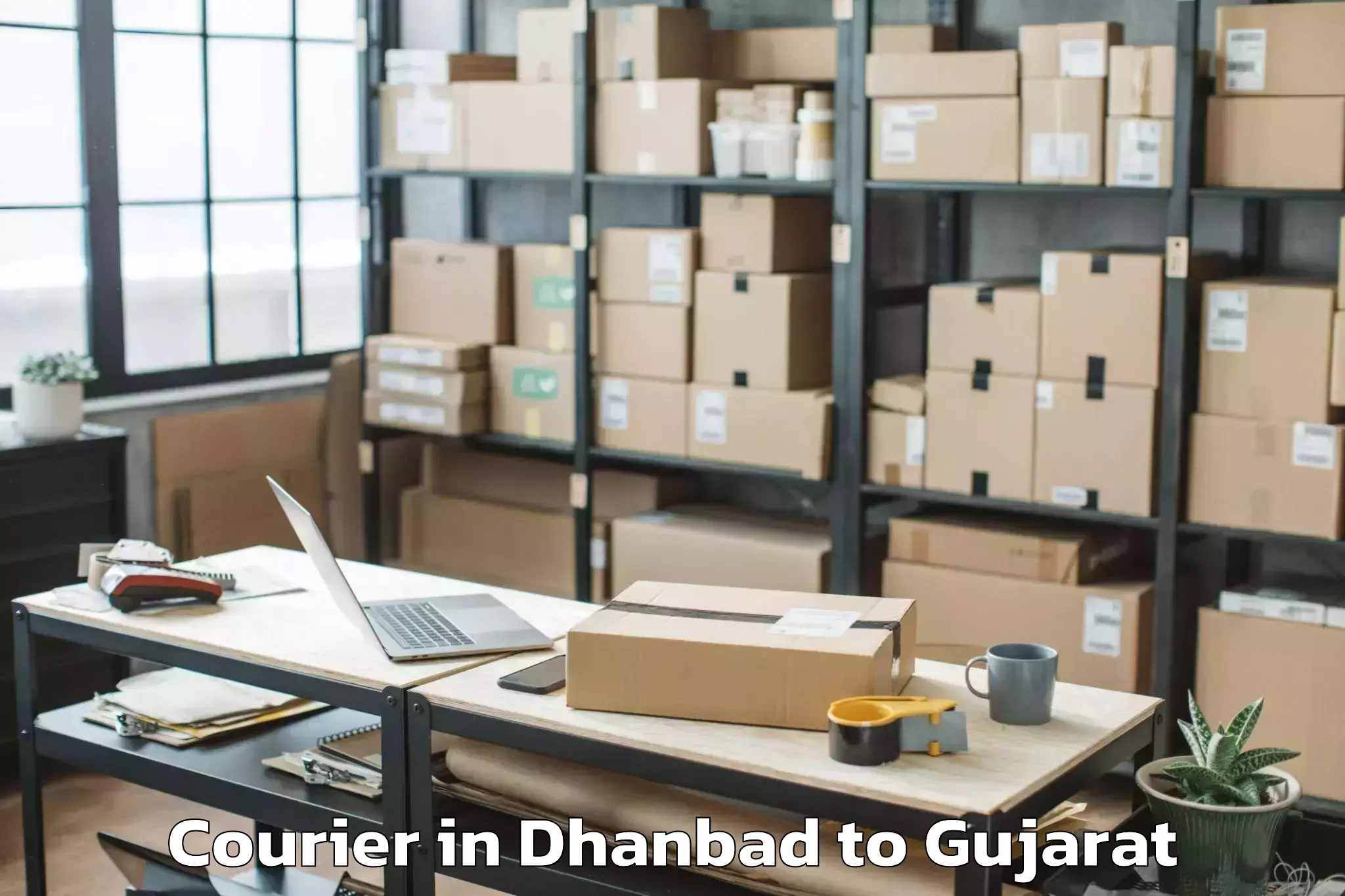 Get Dhanbad to Vaghodia Ina Courier